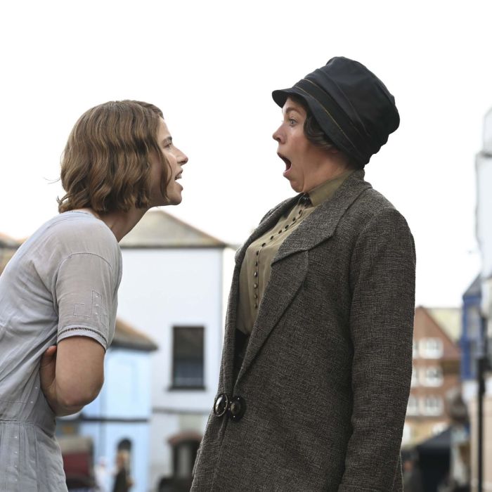 A still from the film, Wicked Little Letters, showing Jessie Buckley and Olivia Coleman in character.
