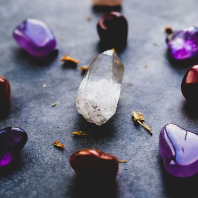 Close-up of purple and white heart shaped stones lying on the floor.