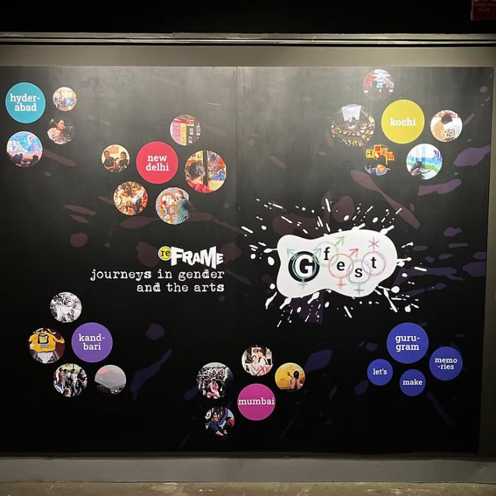 A poster showcasing various aspects and events of gFest with a black background and stuck to a black wall.