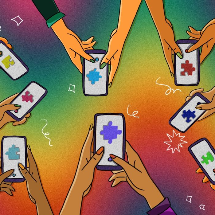 Eight people out of the frame with their hands outstretched in a circle holding phones showing a single jigsaw puzzle piece in different colours on each phone. This is against a vibrant coloured backgroud with a wave-like diffused rainbow going from one side to the other.