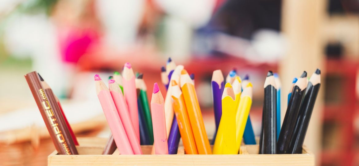 Assorted colour pencils in a pencil stand.