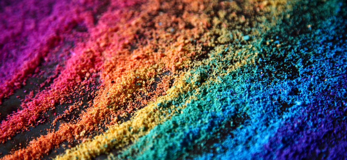 Coloured chalk dust collected and arranged in diagonal piles.